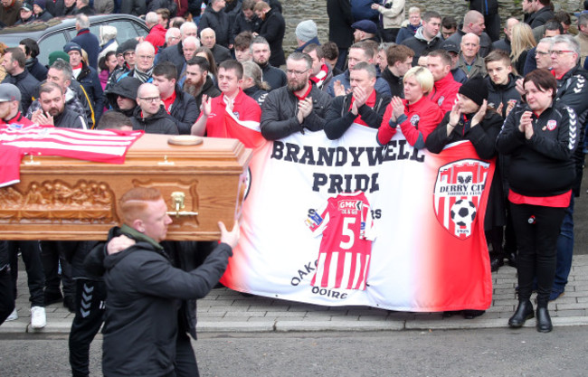 The remains of the late Derry City captain, Ryan McBride, are carried from the church after Requiem Mass