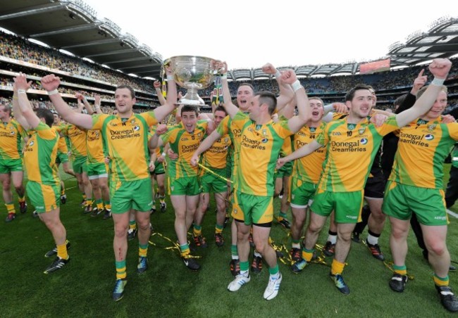 Donegal players celebrate with the Sam Maguire