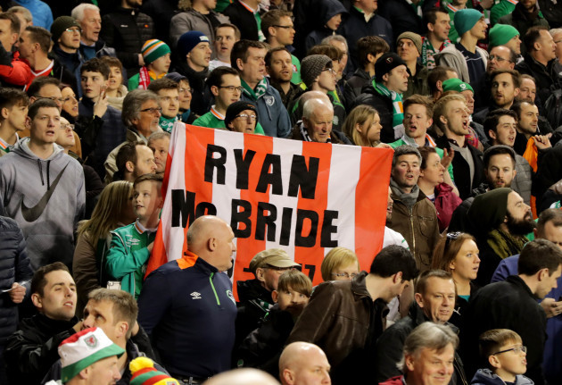 Ireland fans show their respect to the late Ryan McBride of Derry City