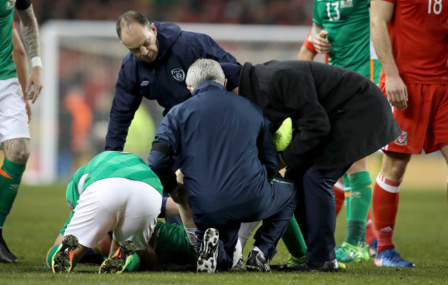 Shane Long with the injured Seamus Coleman