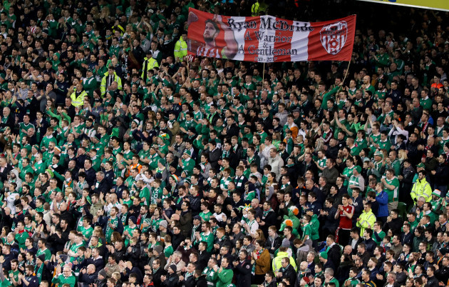 Ireland fans applaud during the 5th minute in respect for the late Ryan McBride