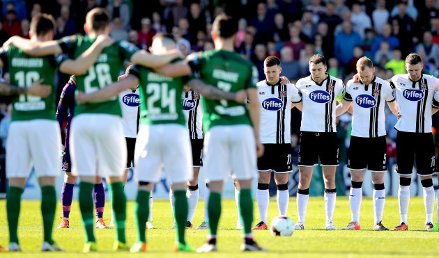 Two teams stand for a minutes silence in memory of Derry City captain Ryan McBride