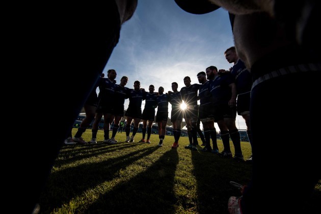The Leinster team huddle on the pitch after the match