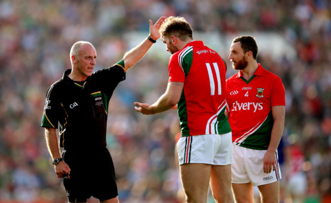 Aidan O'Shea and Keith Higgins speak with referee Cormac Reilly