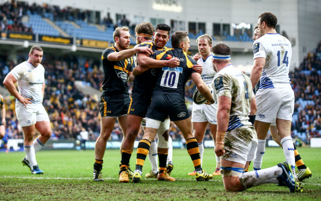 Jimmy Gopperth celebrates scoring his sides first try with Charles Piutau and Dan Robson