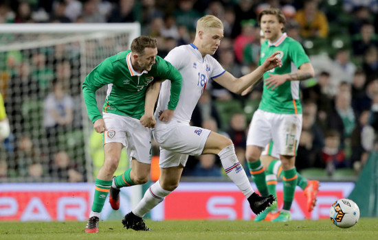 Aiden McGeady with Hordur Bjorgvin Magnusson