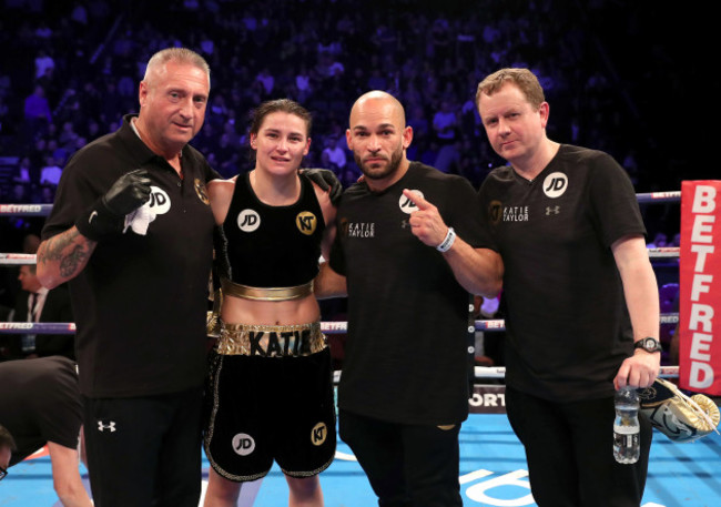 Katie Taylor with her team after the fight