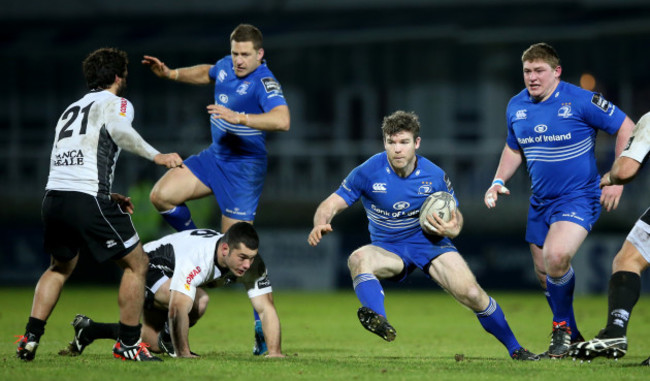 Gordon D'Arcy supported by Jimmy Gopperth and Tadhg Furlong