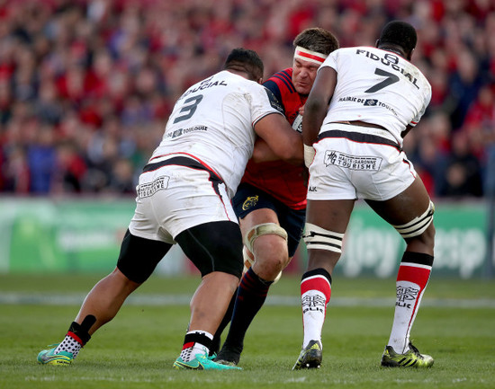 Billy Holland tackled by Census Johnston and Yacouba Camara