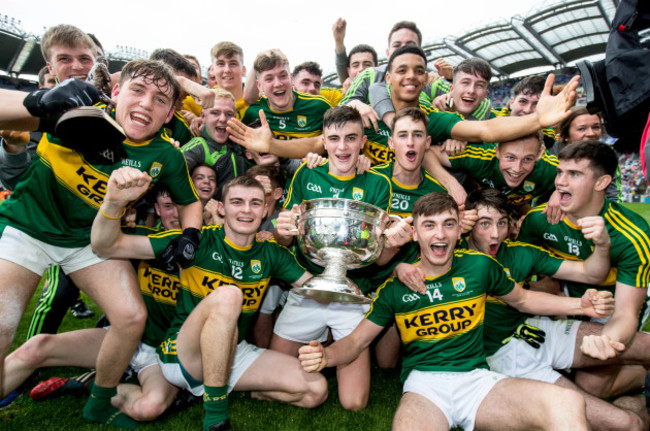 Kerry players celebrate with the cup after the game
