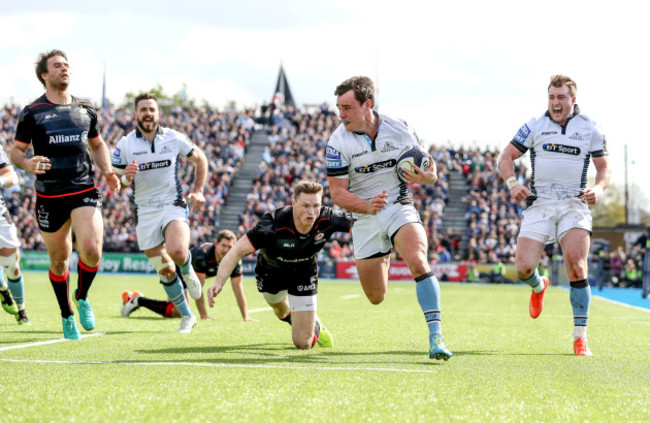 Lee Jones beats Chris Ashton to run in a try as Stuart Hogg celebrates