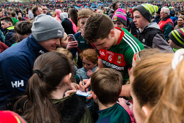 Lee Keegan signs autographs after the game