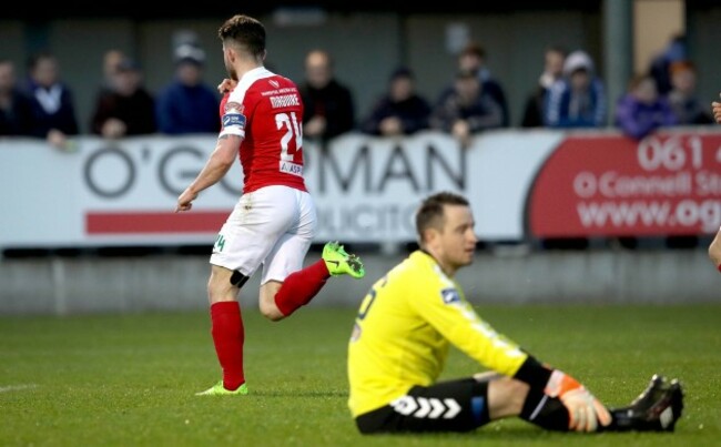 Sean Maguire celebrates scoring the first goal of the game as goalkeeper Brendan Clarke looks on dejected