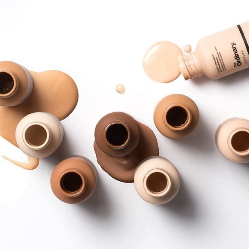 Colours has (or debatably have) arrived! All 42 of them! Colours is an evolving collection of colour formulations from The Ordinary. The offering begins with lightweight Serum Foundations and highly-pigmented Coverage Foundations with each form available in a comprehensive shade range across 21 shades. Serum Foundations are very low in viscosity and offer moderate coverage that looks natural with a very lightweight serum feel. Coverage Foundations contain higher pigment levels in a non-oily cream texture but still offer a smooth finish that avoids the heavy makeup look that can make skin appear more aged. The pigments used in both formats are treated for a rich, highly-saturated effect. These pigments are suspended in our proprietary spreadability system that allows pigments to look natural on the skin, resist collecting within fine lines and stay on for longer. Both formulations offer SPF 15 protection that's mineral-based and avoid the use of chemical sunscreens entirely. The formulations are and will be the same in all markets but the packaging will claim SPF 15 only in the European Union initially while regulatory processes for claiming SPF in other markets are carried out individually. Serum Foundations: £5.70 (UK)/$6.70 (US/CA); Coverage Foundations: £5.90 (UK)/$6.90 (US/CA). (Hint 1: it's April 1st. Hint 2: Monkeys are always late. Hint 3: It's all coming mid April because everyone wanted pumps instead of droppers and caps