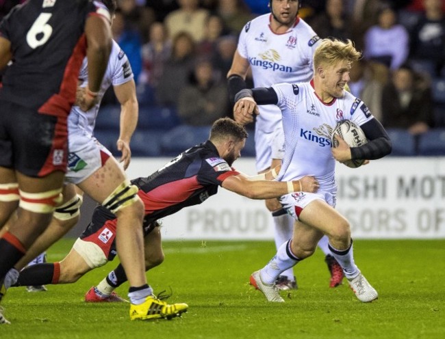 Rob Lyttle is tackled by Sean Kennedy