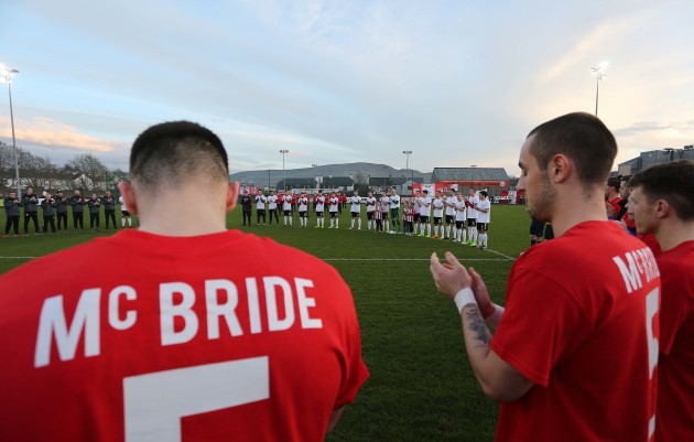 Players from both teams observe a minutes applause for late Derry City captain Ryan McBride