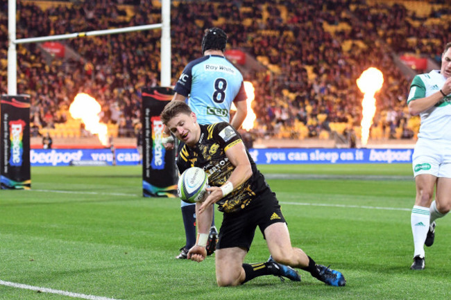 Beauden Barrett celebrates scoring a try