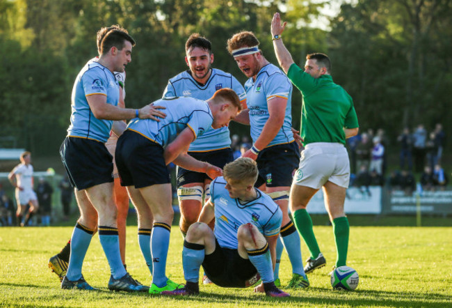 Tommy O'Brien celebrates scoring a try with teammates