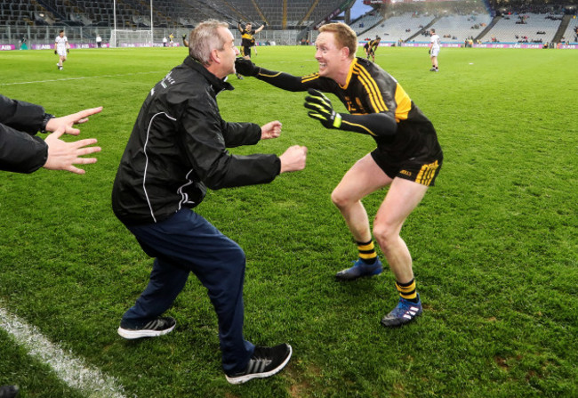 Colm Cooper celebrates with Pat O'Shea