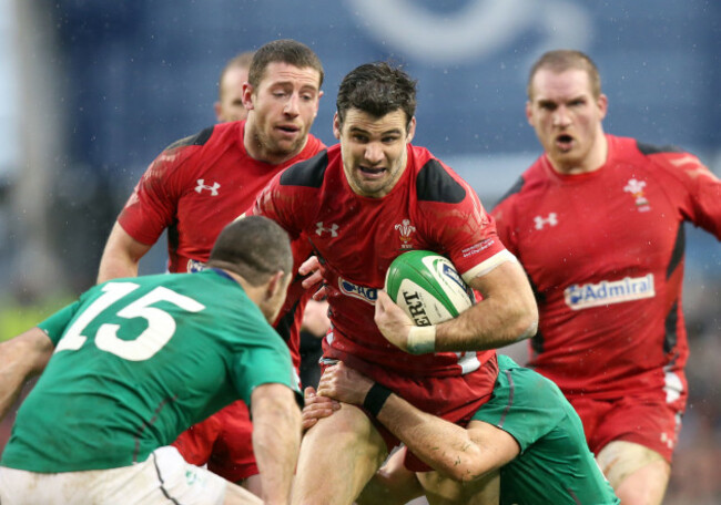 Mike Phillips is tackled by Conor Murray