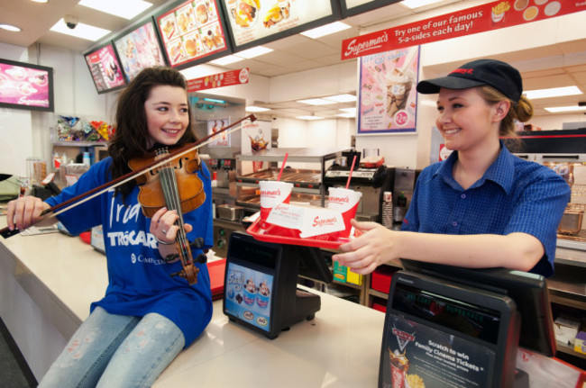 Ciara Murphy serves up some trad to Supermacs employee Stephanie Graham.