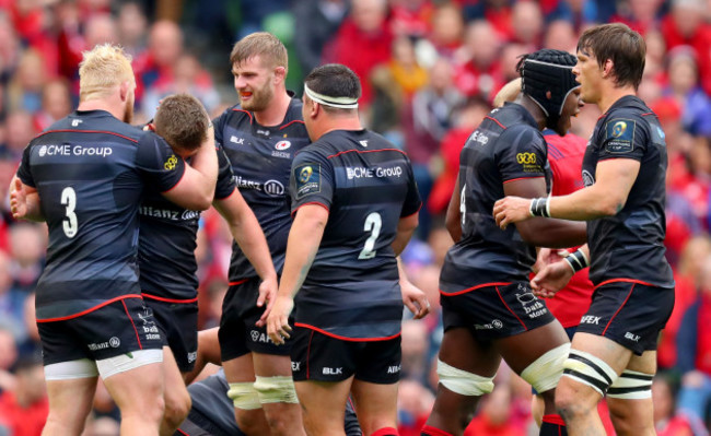 Owen Farrell celebrates winning a penalty with George Kruis and Vincent Koch