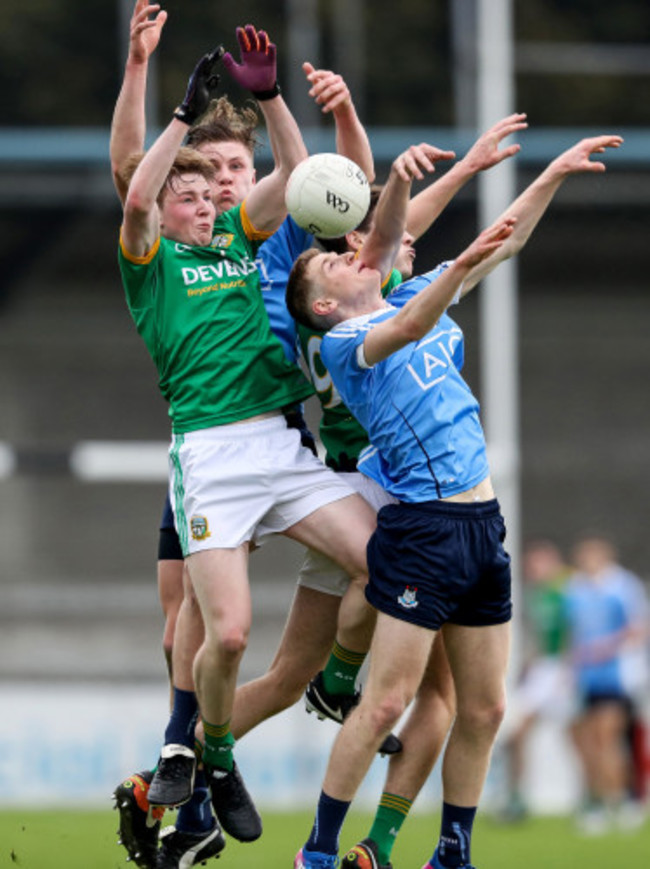 Players attempt to field a high ball