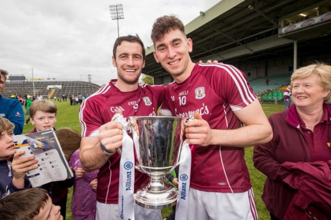 Jason Flynn with captain David Burke celebrate winning the Division 1 trophy