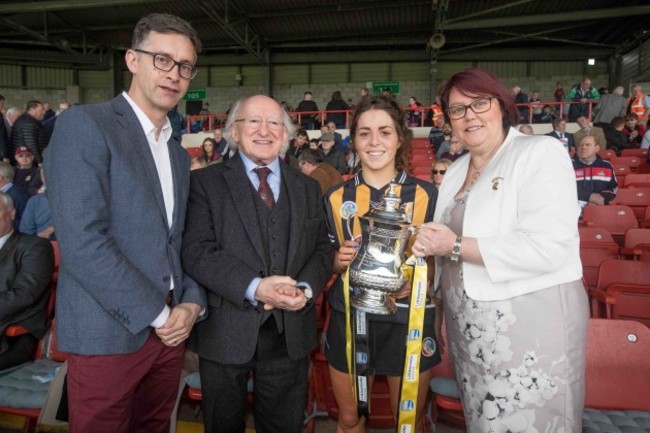 Kilkenny captain Meighan Farrell with the Division 1 trophy alongside John Goodwin (Littlewoods Ireland), President Michael D.Higgins and Camogie President, Catherine Neary