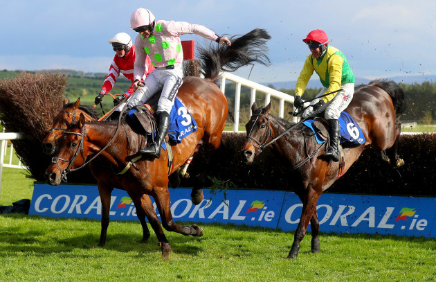 Robbie Power on board Sizing John clears the last to win, beating Ruby Walsh on Djakadam and Nico de Joinville on Coneygree