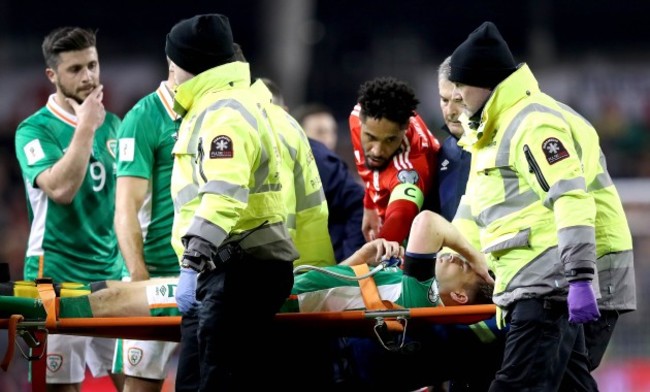 Seamus Coleman leaves on a stretcher