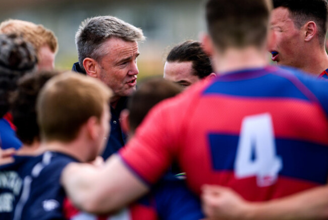 Andy Wood speaks to his players before the game