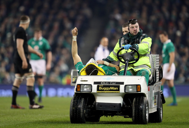Robbie Henshaw salutes the crowd while leaving the field with an injury