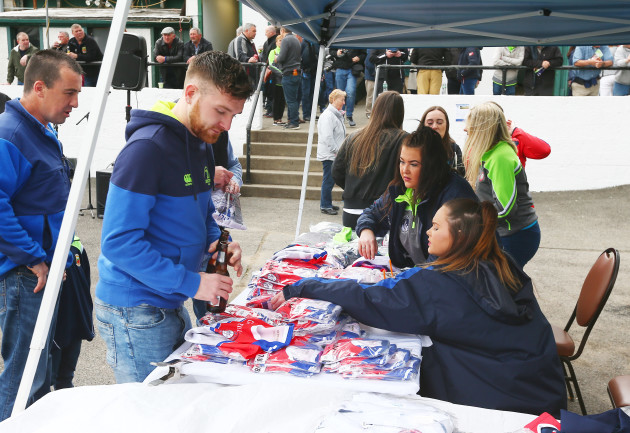 A fan buys merchandise ahead of the game