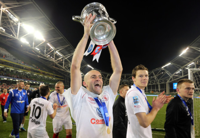 Alan Keane celebrates with the cup after the game