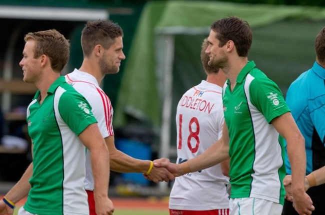 Brothers Mark Gleghorne and Paul Gleghorne shake hands before the game in which they play for England and Ireland respectively