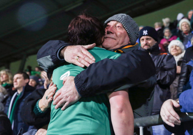 Lindsay Peat is consoled by her father Ken after the game