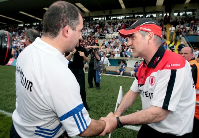 Mickey Harte shakes hands with Seamus McEnaney