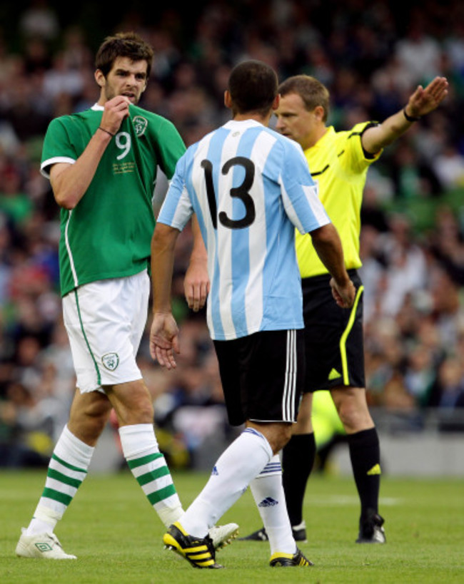 Cillian Sheridan gestures towards Walter Samuel