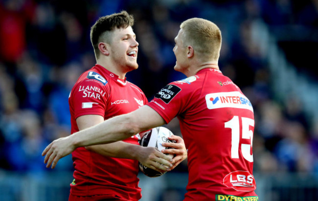 Steff Evans celebrates scoring a try with Johnny McNicholl