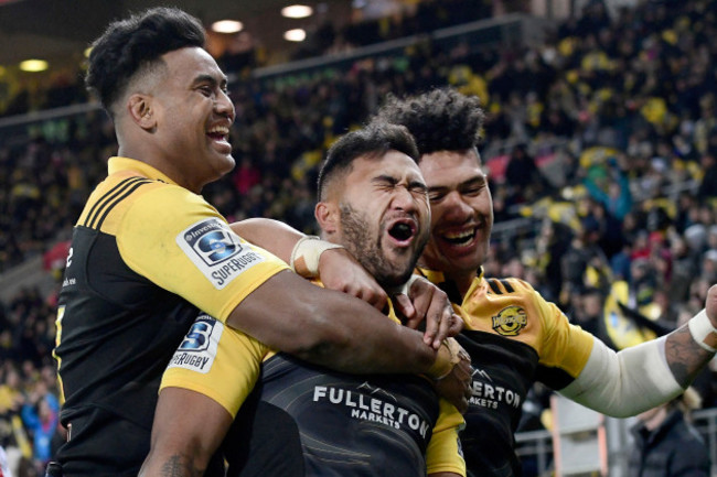 Vince Aso celebrates his try with Julian Savead and Ardie Savea