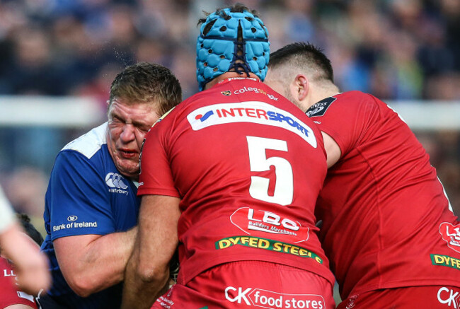 Tadhg Furlong tackled by Tadhg Beirne and Rob Evans