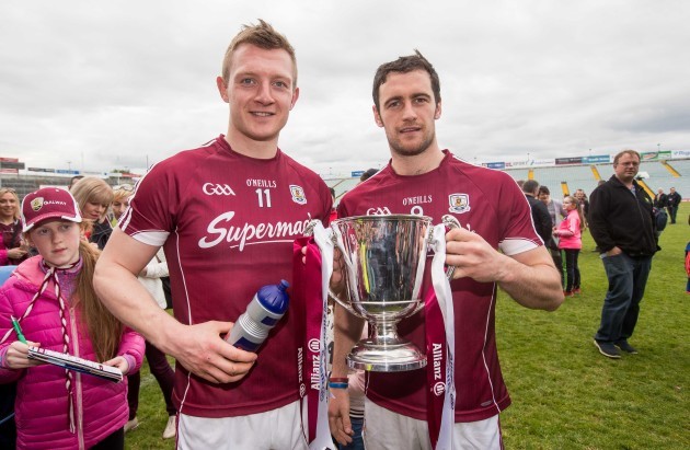 Galway's Joe Canning with captain David Burke celebrate winning the Division 1 trophy