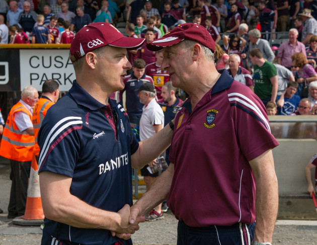 Michael Donoghue and Michael Ryan shake hands after the game