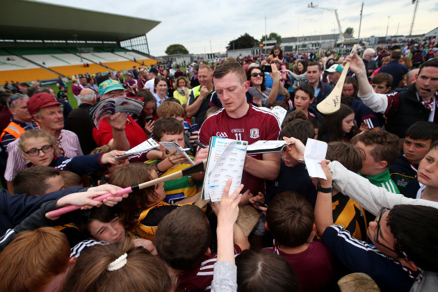 Joe Canning signs autographs after the game