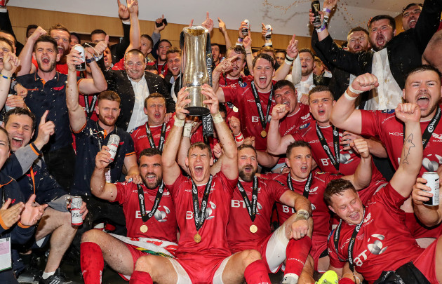 Scarlets celebrate with the trophy