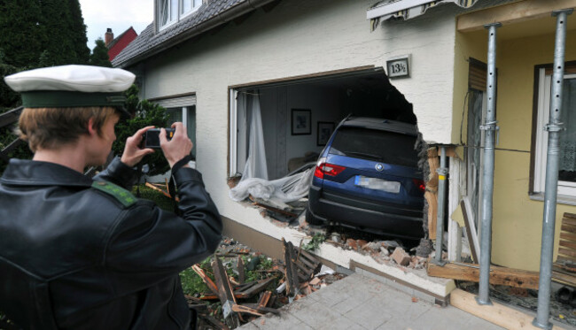 Car crashed through wall of house