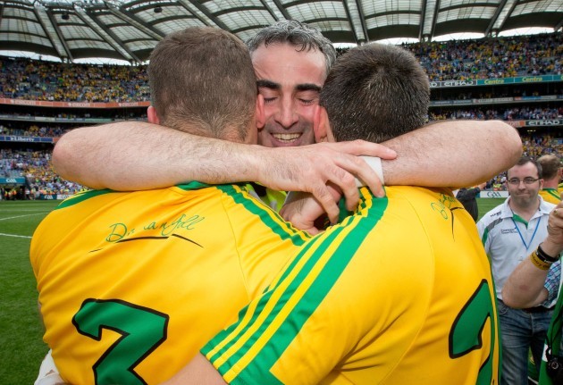 Jim McGuinness celebrates the final whistle with Neil McGee and Eamonn McGee