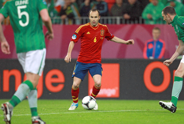 Andres Iniesta with John O'Shea and Richard Dunne