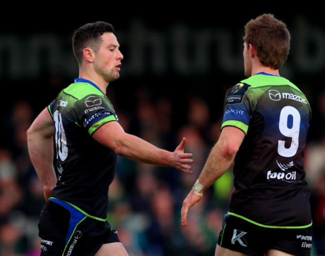 John Cooney celebrates his try with Kieran Marmion